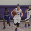 Katelyn Cole brings the ball down the court against Hanford West.